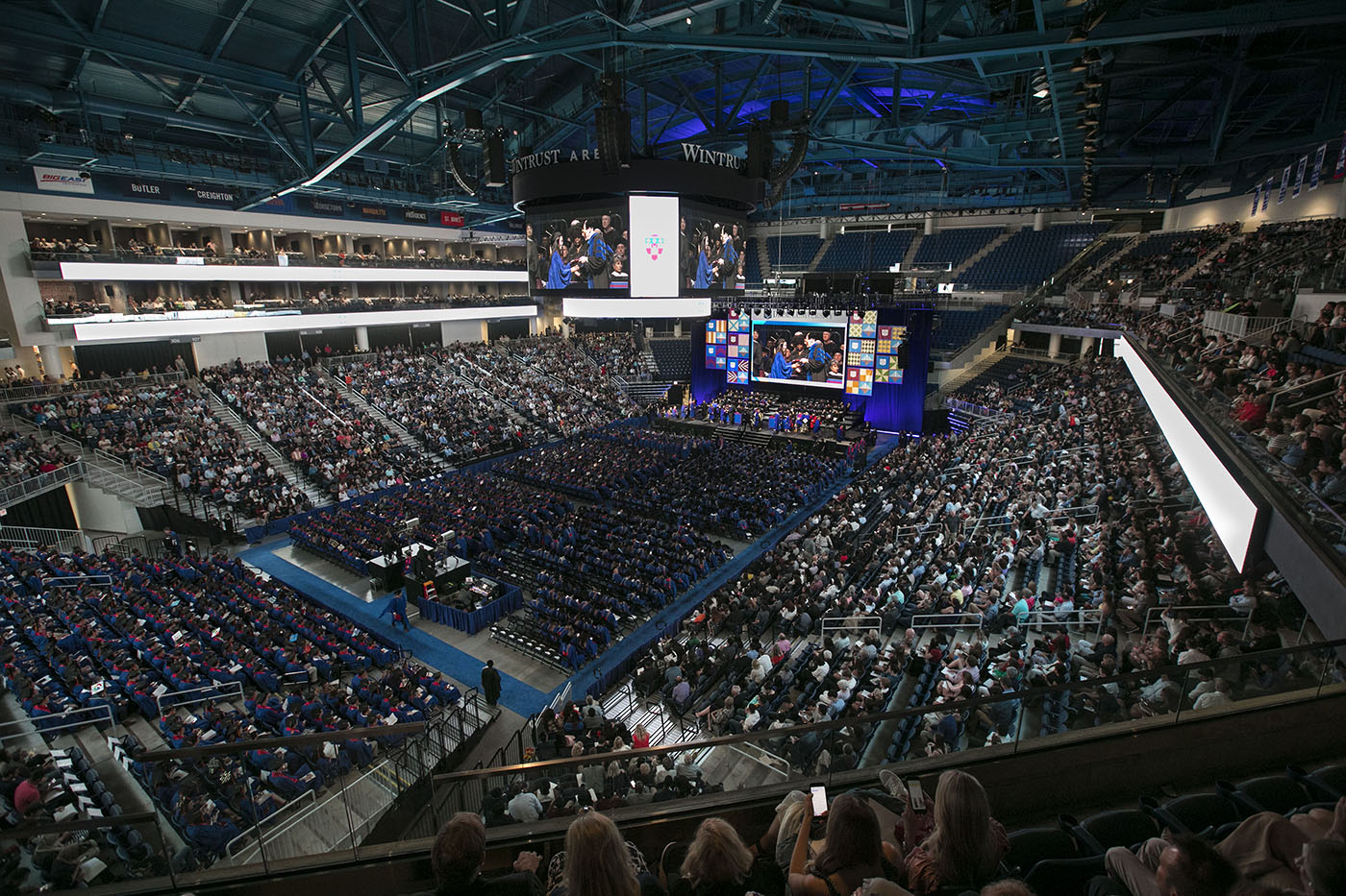 Friends and family join DePaul graduates inside Wintrust Arena, Sunday, June 10, 2018, for the Driehaus College of Business commencement ceremony
